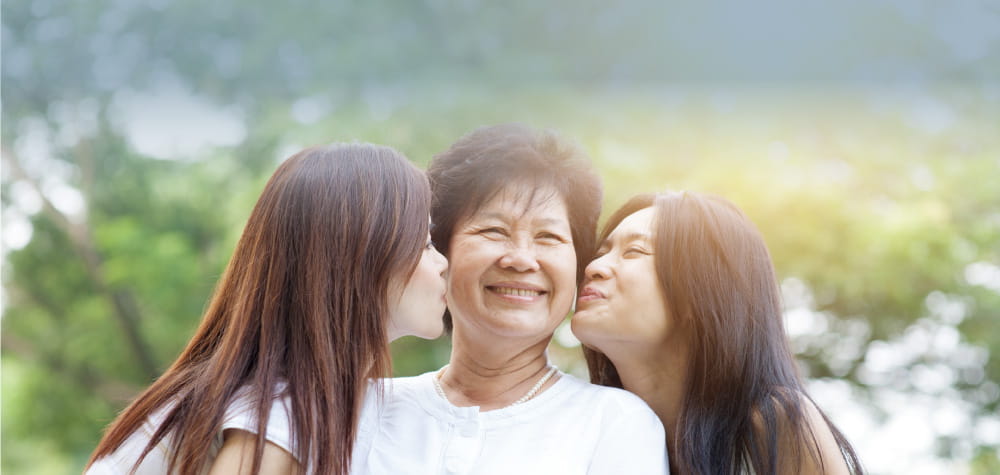 elderly retired senior asian mother with adult daughters guardianship